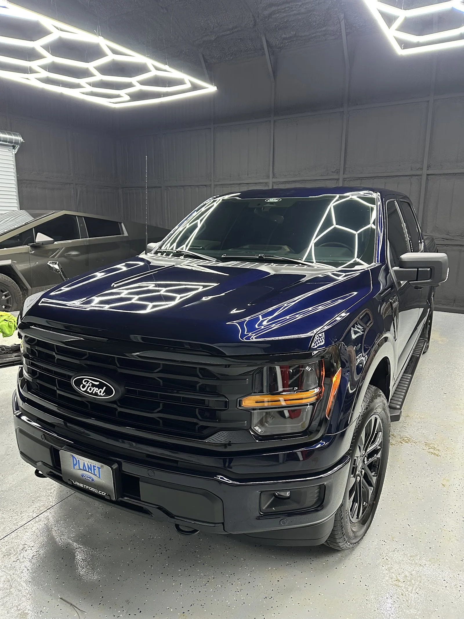 Ford F-150 tinted inside Texan Tint Pro's Conroe work bay